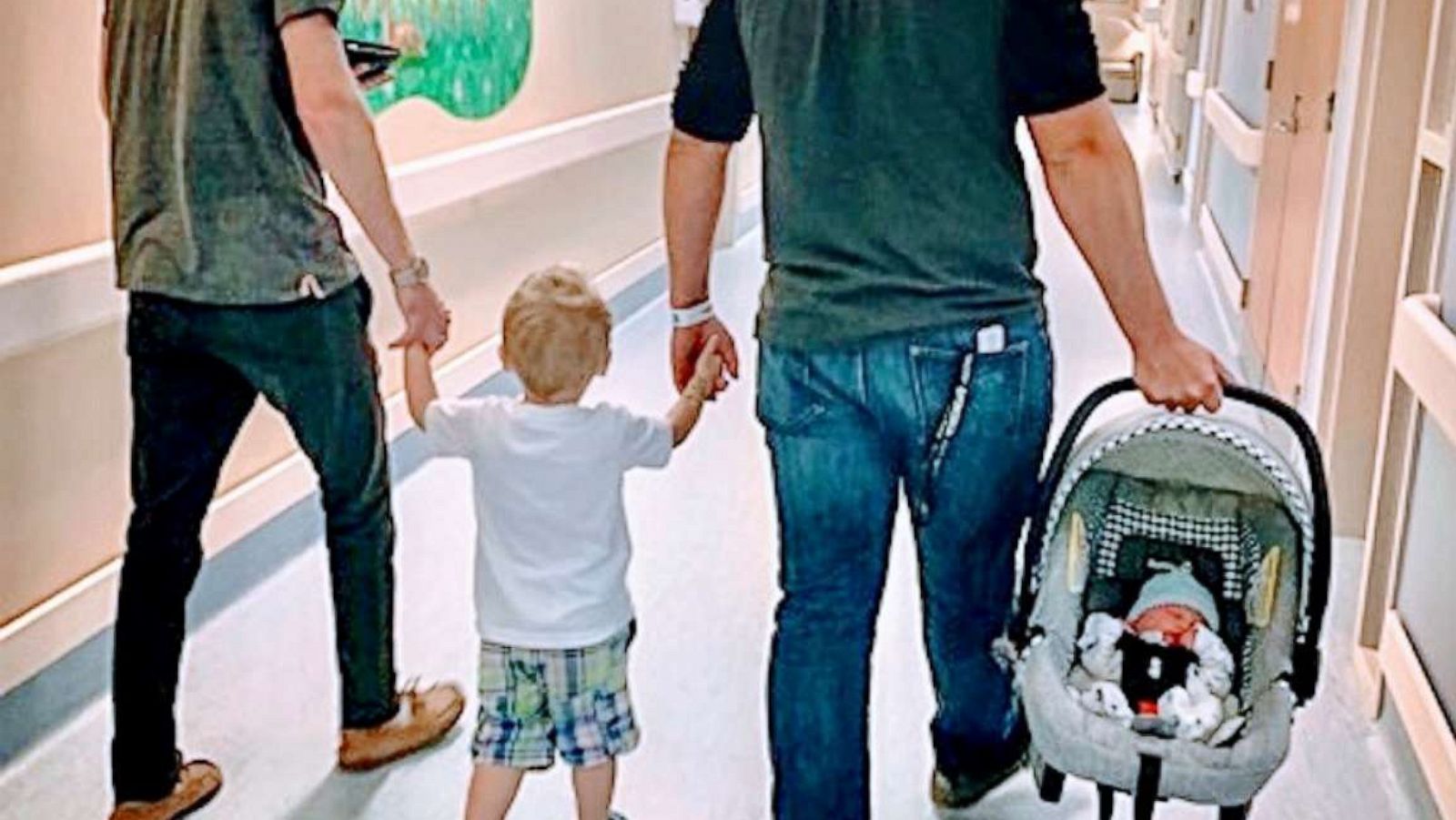 PHOTO: Madison Holley of Corunna, Ontario, shared an image of her former partner and current fiance exiting the hospital hand-in-hand with her toddler son, along with her newborn.