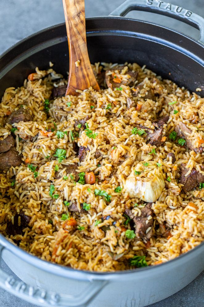 PHOTO: This rice pilaf and braised lamb dish comes together in a cast-iron Dutch oven.