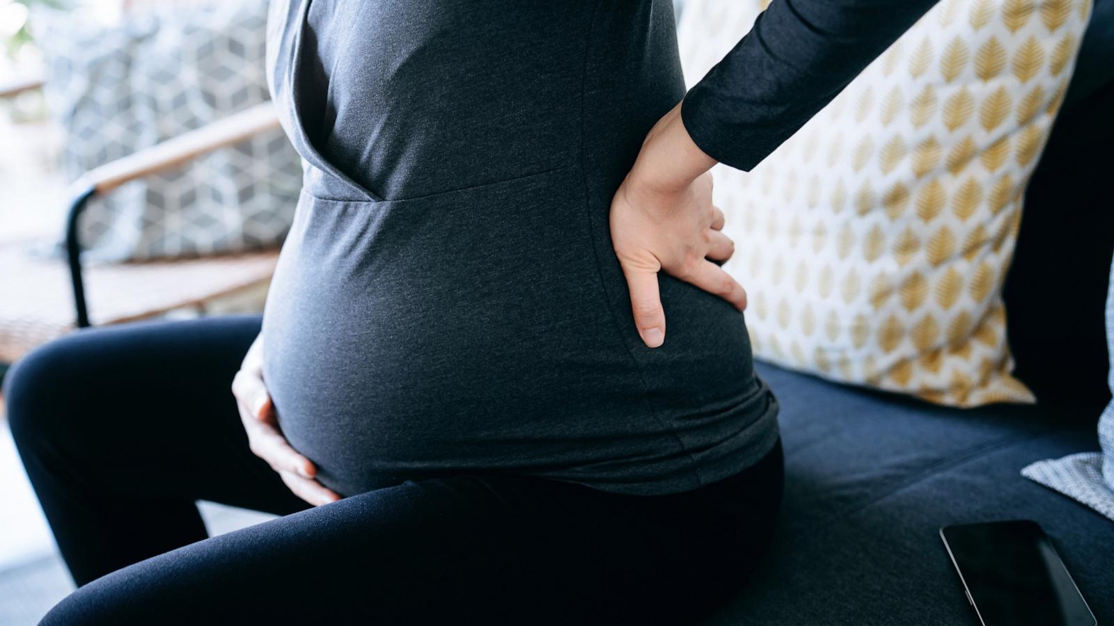 PHOTO: In this undated stock photo, a pregnant woman is seen holding her stomach and lower back.