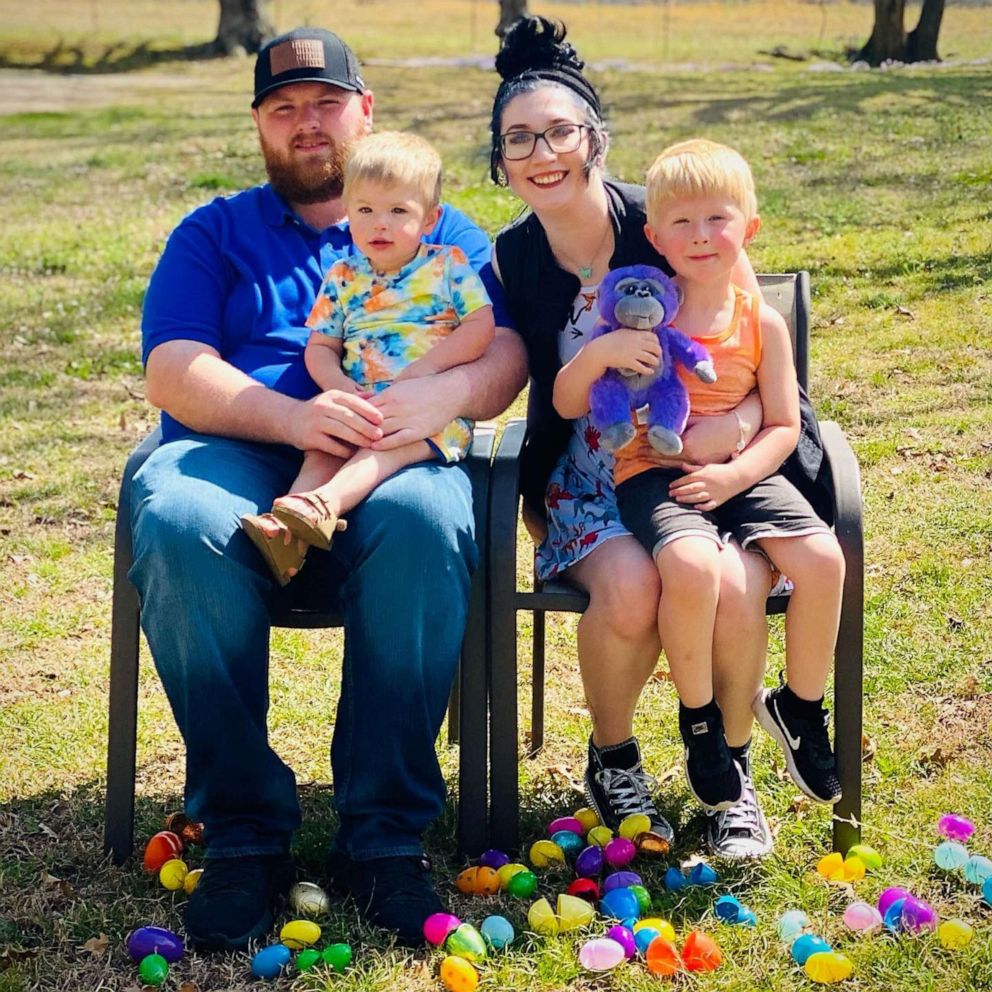 PHOTO: Cassie Fisher, of Oklahoma, poses with her husband and their two sons on April 4, 2021.