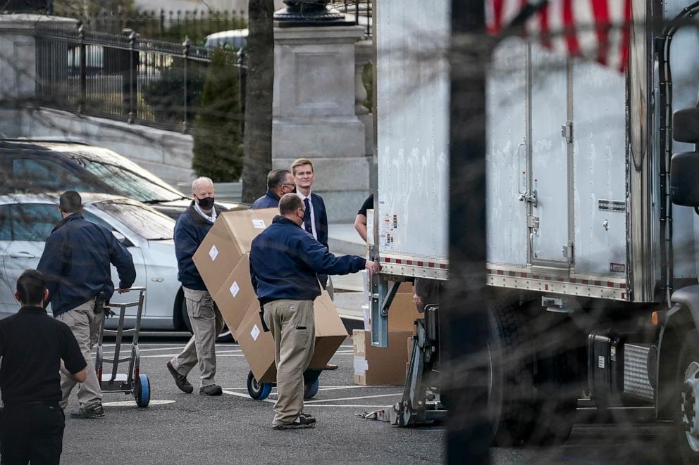 PHOTO: Workers move boxes onto a truck on West Executive Avenue between the West Wing of the White House and the Eisenhower Executive Office Building at the White House, Jan. 14, 2021, in Washington.