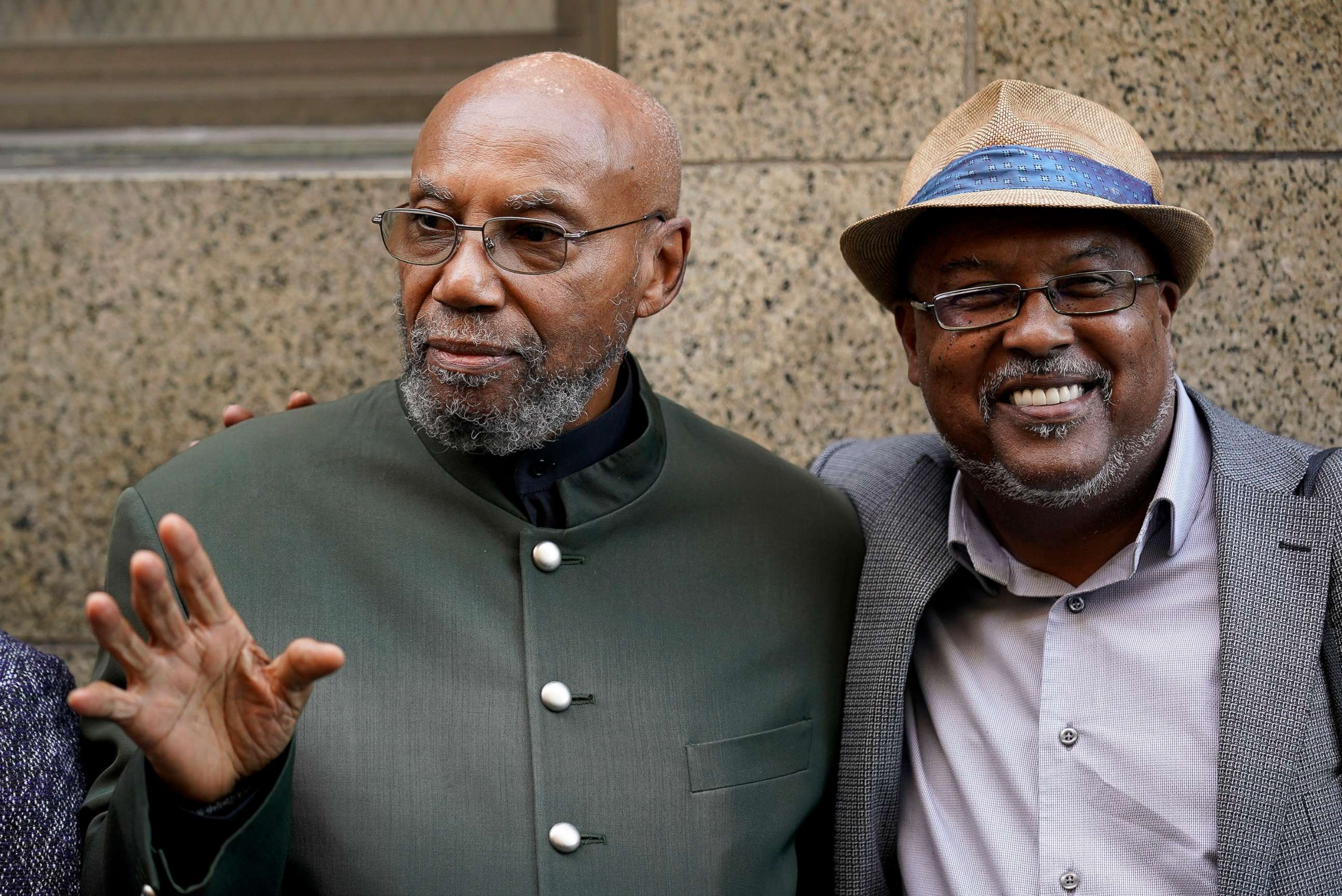 PHOTO: Muhammad Aziz stands outside Manhattan court with journalist Abdur-Rahmman Muhammad, after Aziz's conviction in the killing of Malcolm X was vacated, Nov. 18, 2021, in New York.  
