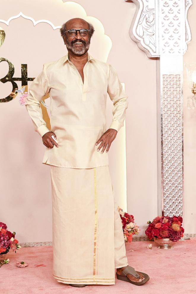 PHOTO: Indian actor Rajinikanth poses for photos as he arrives to attend the wedding ceremony of billionaire tycoon and Chairman of Reliance Industries Mukesh Ambani's son Anant Ambani and Radhika Merchant, in Mumbai, on July 12, 2024. 