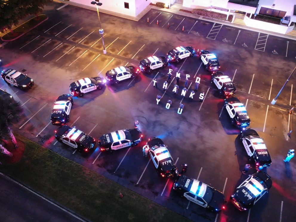 PHOTO: Fort Myers Police Department arranged their police cruisers in the shape of a heart outside Lee Memorial Hospital in Fort Myers, Fla.