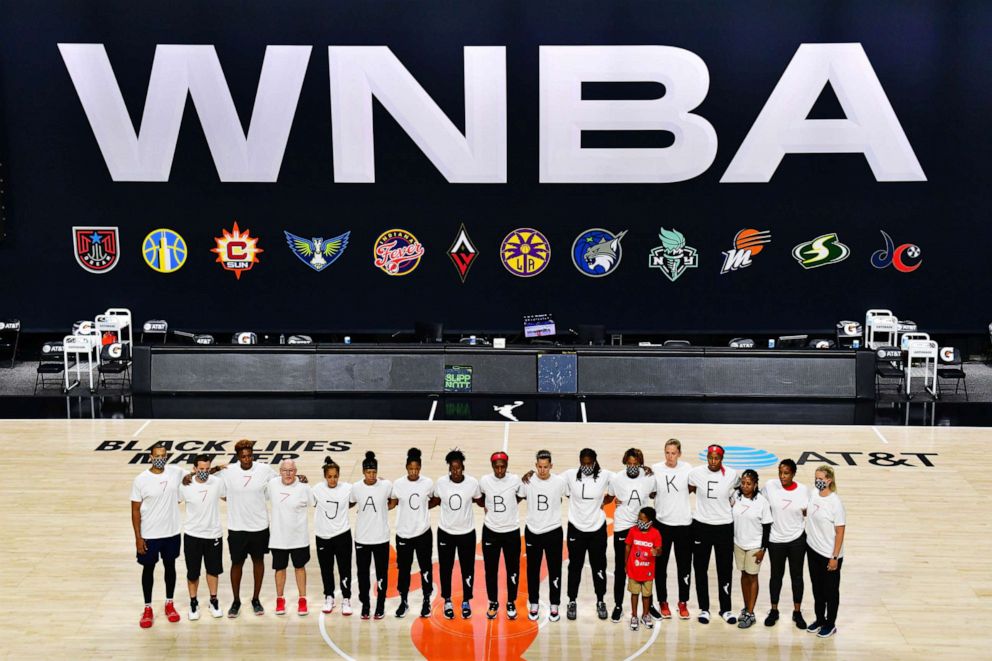 PHOTO: After the WNBA announcement of the postponed games, the Washington Mystics each wear white T-shirts as a protest against the shooting of Jacob Blake by Kenosha, Wisconsin police at Feld Entertainment Center, Aug. 26, 2020 in Palmetto, Fla.