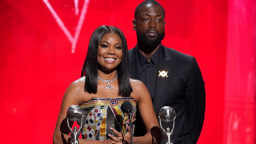 PHOTO: Gabrielle Union-Wade, left, and Dwayne Wade accept the president's award at the 54th NAACP Image Awards on Feb. 25, 2023, at the Civic Auditorium in Pasadena, Calif.