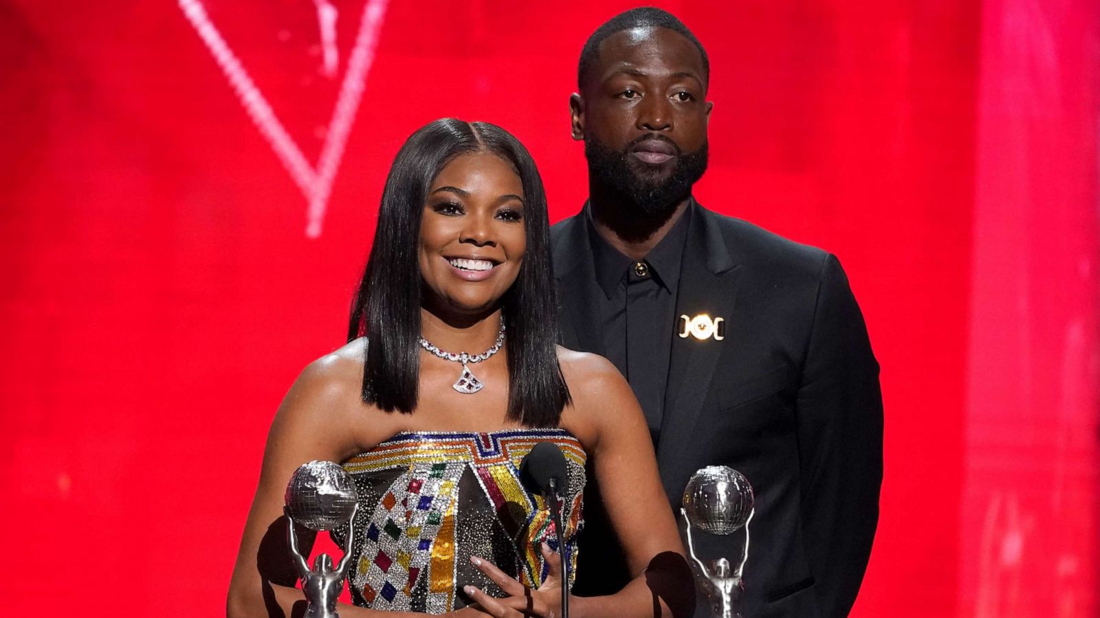 PHOTO: Gabrielle Union-Wade, left, and Dwayne Wade accept the president's award at the 54th NAACP Image Awards on Feb. 25, 2023, at the Civic Auditorium in Pasadena, Calif.