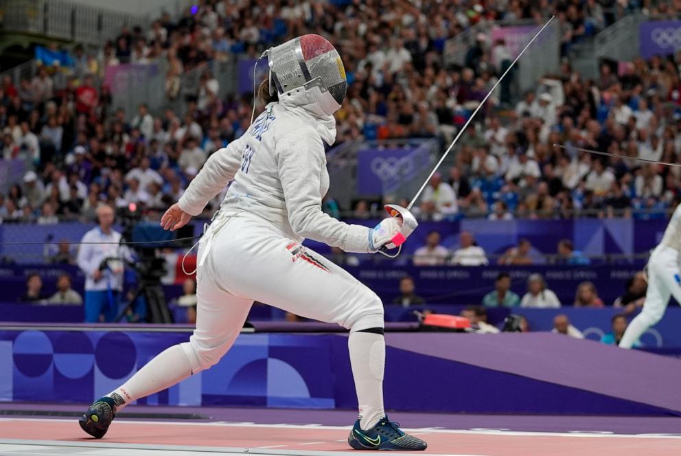 PHOTO: Egypt's Nada Hafez competes with United States' Elizabeth Tartakovsky in the women's individual Sabre round of 32 competition during the 2024 Summer Olympics at the Grand Palais, July 29, 2024, in Paris.