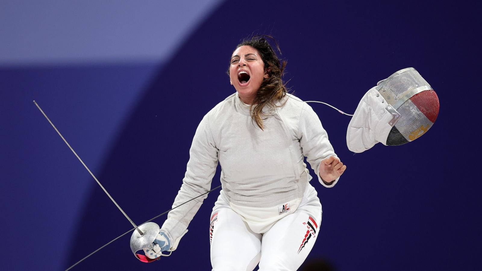 PHOTO: Nada Hafez of Team Egypt celebrates her victory against Elizabeth Tartakovsky of Team United States in the Fencing Women's Sabre Individual Table of 32 on day three of the Olympic Games Paris 2024 at Grand Palais on July 29, 2024 in Paris.