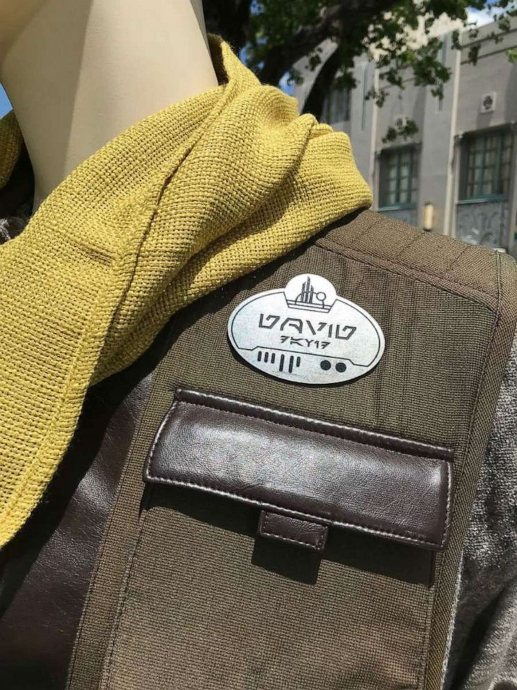 PHOTO: Name tags worn by the villagers in Star Wars: Galaxy's Edge are in both English and Aurebesh. 