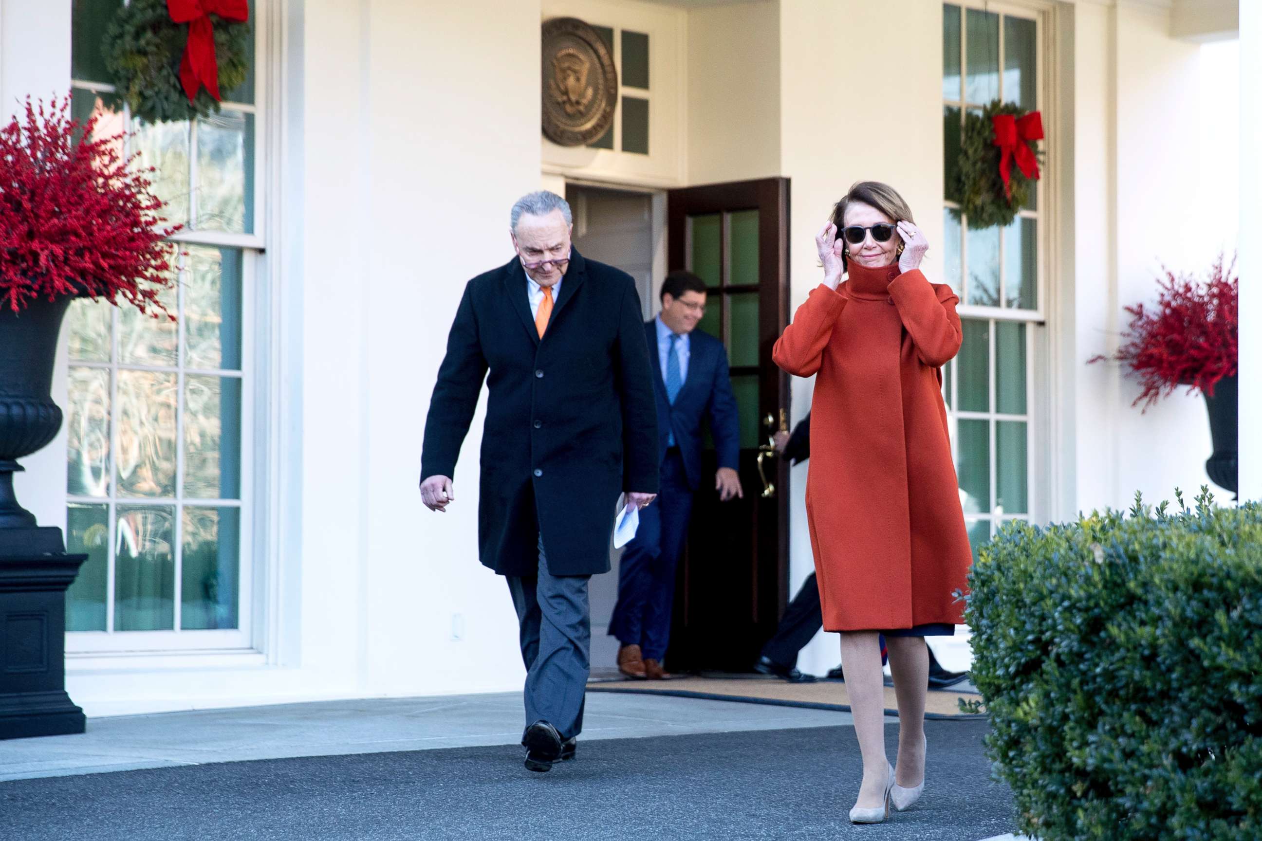 PHOTO: House Minority Leader Nancy Pelosi, right, and Senate Minority Leader Sen. Chuck Schumer walk out of the West Wing to speak to members of the media outside the White House in Washington, Dec. 11, 2018.