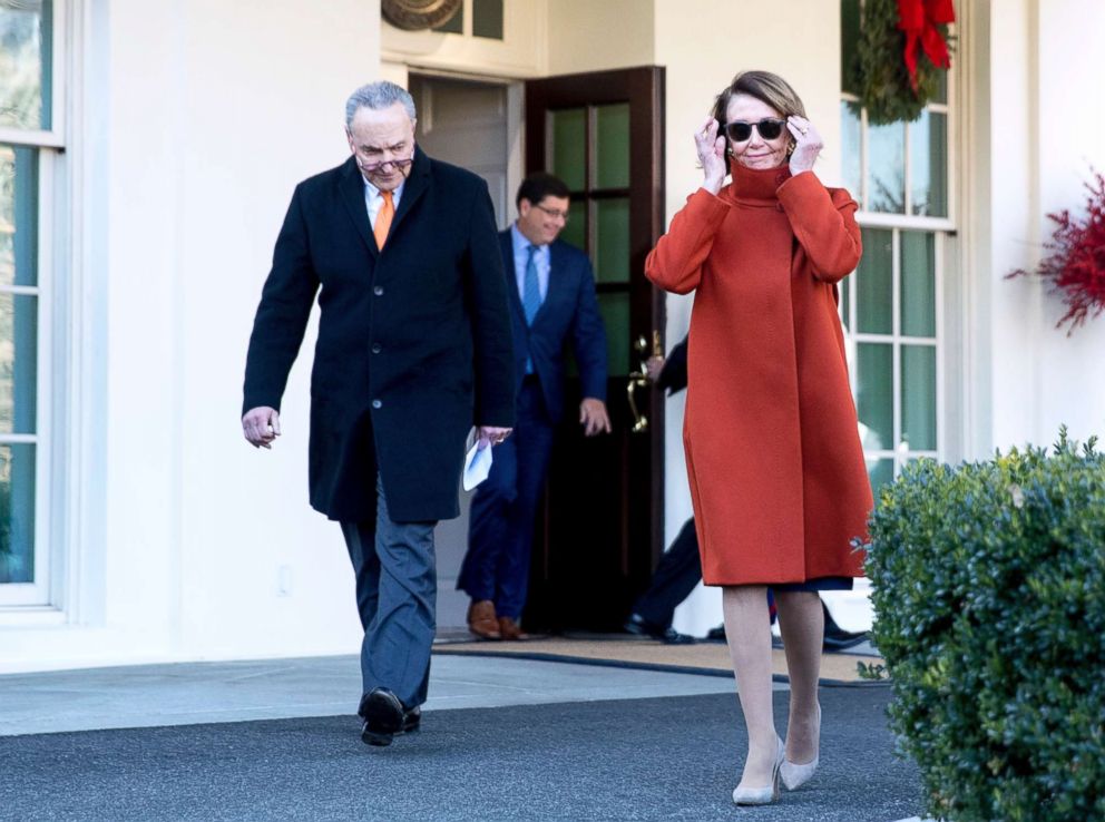 PHOTO: House Minority Leader Nancy Pelosi, right, and Senate Minority Leader Sen. Chuck Schumer walk out of the West Wing to speak to members of the media outside the White House in Washington, Dec. 11, 2018.