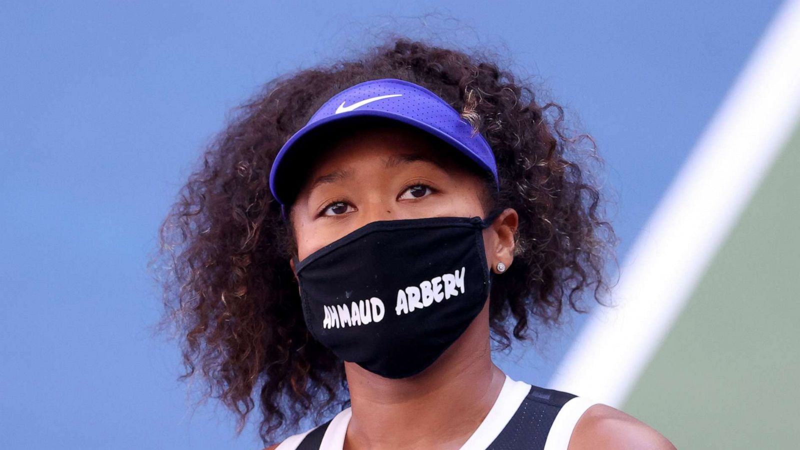 PHOTO: Naomi Osaka of Japan wears a protective face mask with the name Ahmaud Arbery stenciled on it after winning her Women's Singles third round match against Marta Kostyuk of the Ukraine on Day Five of the 2020 US Open on Sept. 4, 2020 in New York.