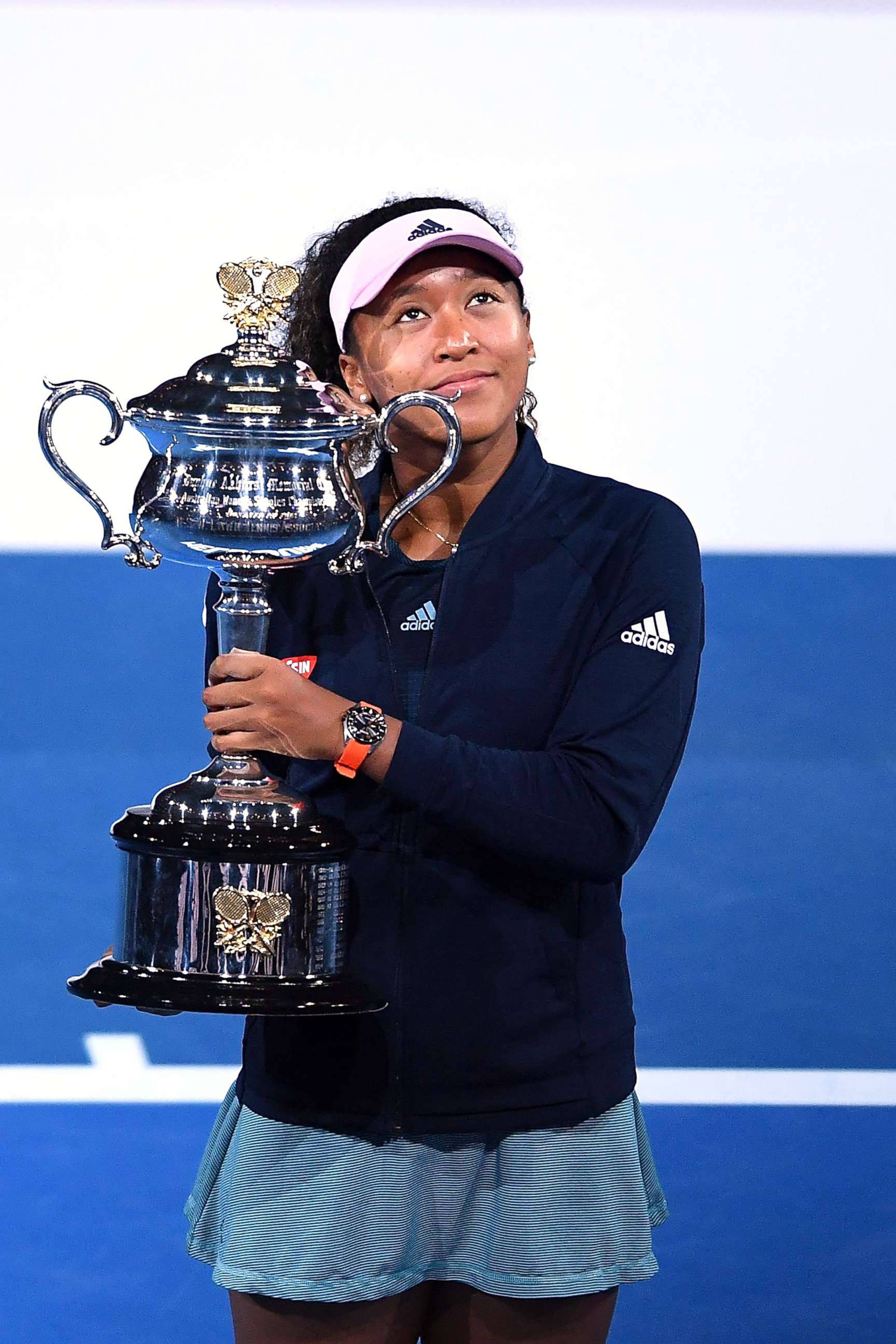 PHOTO: Naomi Osaka of Japan reacts during the presentation of the winner's trophy after defeating Petra Kvitova of the Czech Republic in the women's singles final at the Australian Open Grand Slam tennis tournament in Melbourne, Australia, Jan. 26, 2019.