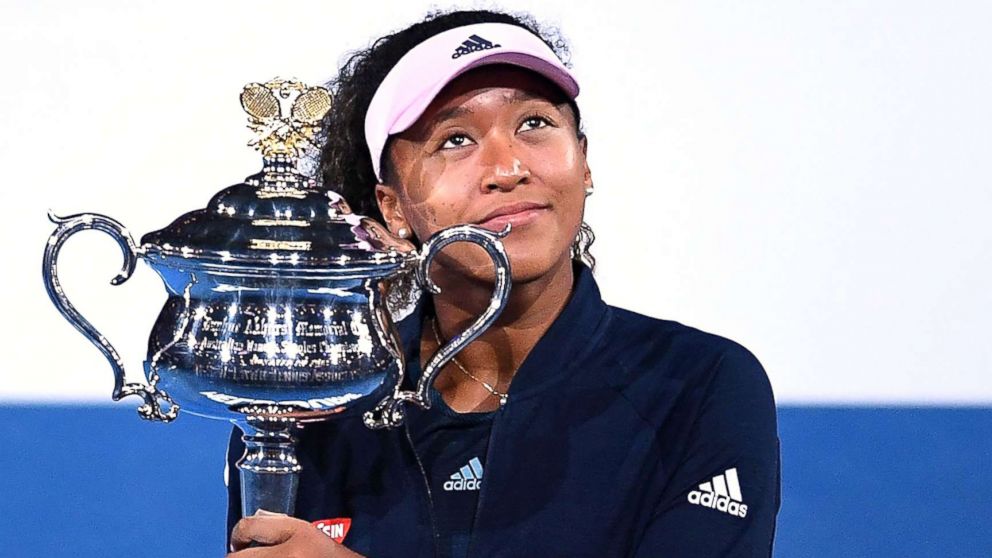 PHOTO: Naomi Osaka of Japan reacts during the presentation of the winner's trophy after defeating Petra Kvitova of the Czech Republic in the women's singles final at the Australian Open Grand Slam tennis tournament in Melbourne, Australia, Jan. 26, 2019.