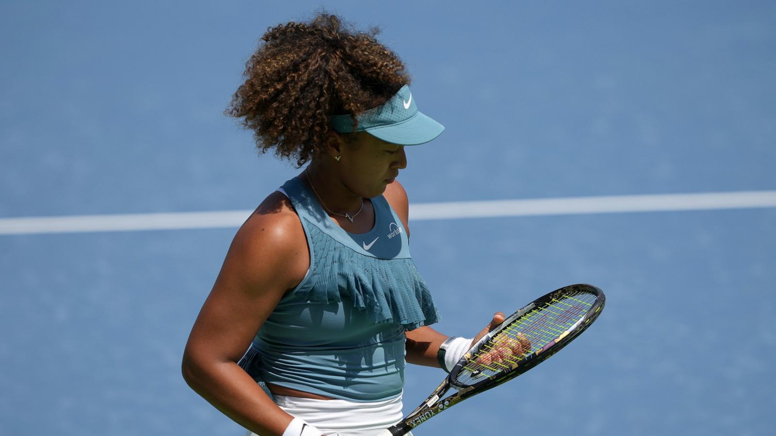 PHOTO: Naomi Osaka of Japan walks across the court during her match against Ashlyn Krueger of the United States (not pictured) during Day 2 of the Cincinnati Open at the Lindner Family Tennis Center on Aug. 12, 2024 in Mason, Ohio.