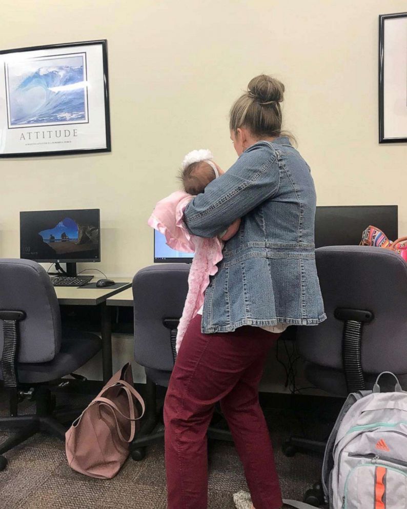 PHOTO: Dr. Julie George held the baby of her student, Katie Lewis, while Lewis took a test. 