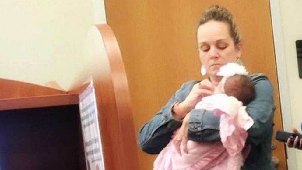 PHOTO: Dr. Julie George held the baby of her student, Katie Lewis, while mom took a test at UT Tyler Palestine.