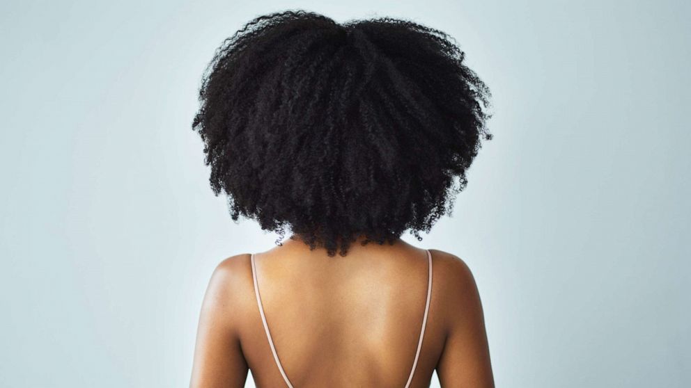 PHOTO: A woman with curly hair is seen in this stock photo.