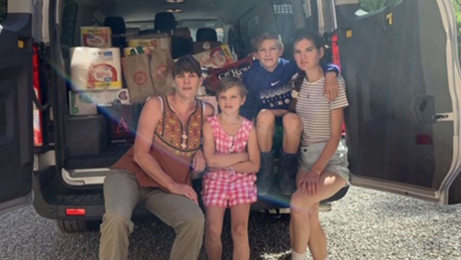 PHOTO: Jess Falkenhagen and her kids load a van full of supplies in Santa Fe, N.M., before delivering items to the Navajo reservation in Window Rock, Ariz.