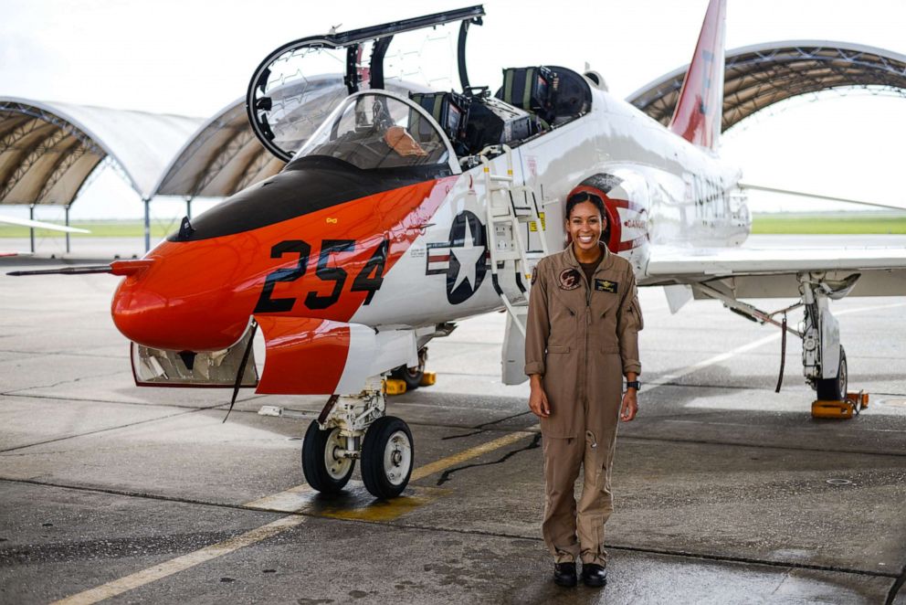 PHOTO: Student Naval Aviator Lt. j.g. Madeline Swegle stands by a T-45C Goshawk training aircraft following her final flight to complete the undergraduate Tactical Air (Strike) pilot training syllabus, July 7, 2020.