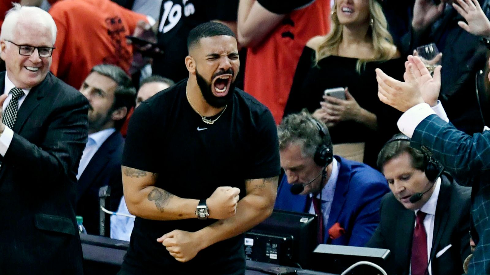 PHOTO:Rapper Drake reacts during the second half of basketball action between the Toronto Raptors and the Golden State Warriors in Game 5 of the NBA Finals in Toronto, June 10, 2019.