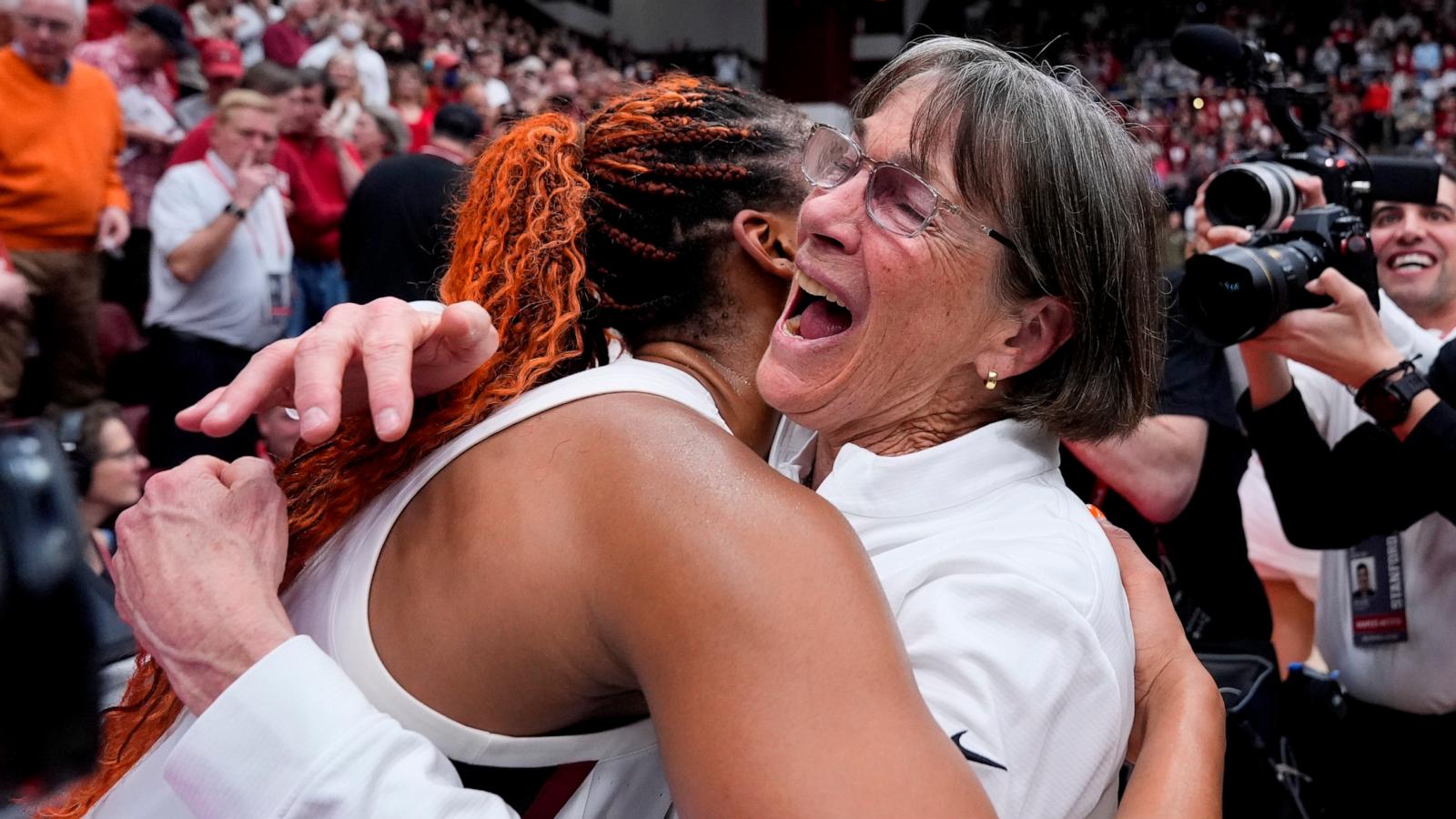 PHOTO: Stanford head coach Tara VanDerveer, right, is congratulated by forward Kiki Iriafen after the team's victory over Oregon State in an NCAA college basketball game, Jan. 21, 2024, in Stanford, Calif.