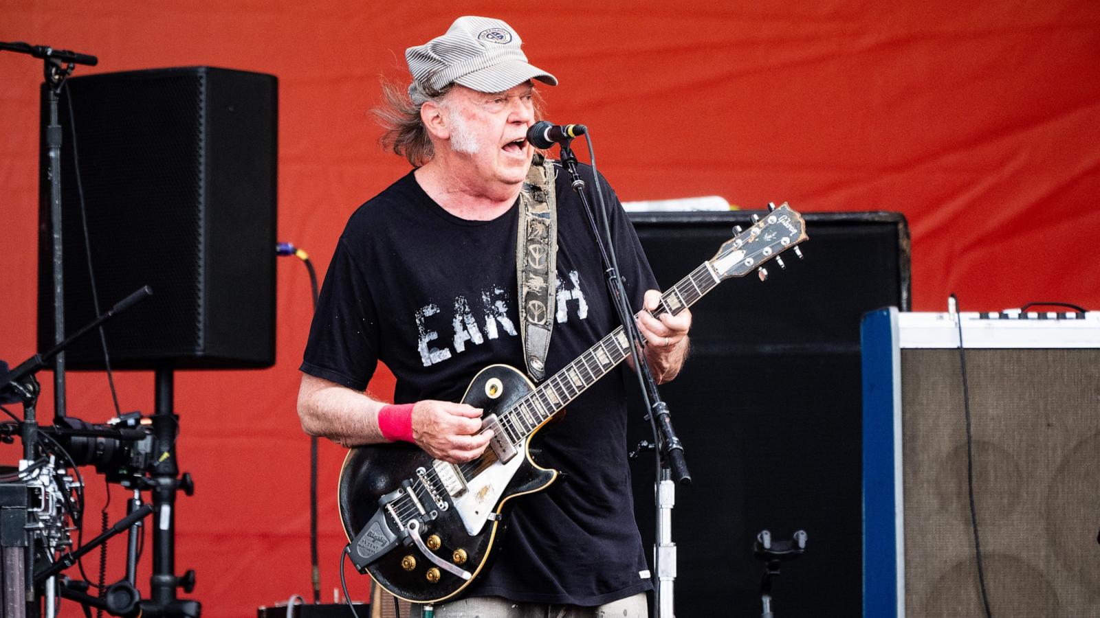 PHOTO: Neil Young performs on Day 7 of 2024 New Orleans Jazz & Heritage Festival at Fair Grounds Race Course on May 04, 2024 in New Orleans.