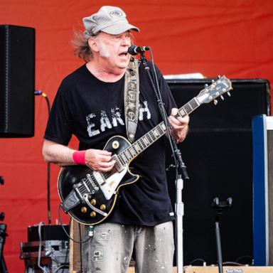 PHOTO: Neil Young performs on Day 7 of 2024 New Orleans Jazz & Heritage Festival at Fair Grounds Race Course on May 04, 2024 in New Orleans.