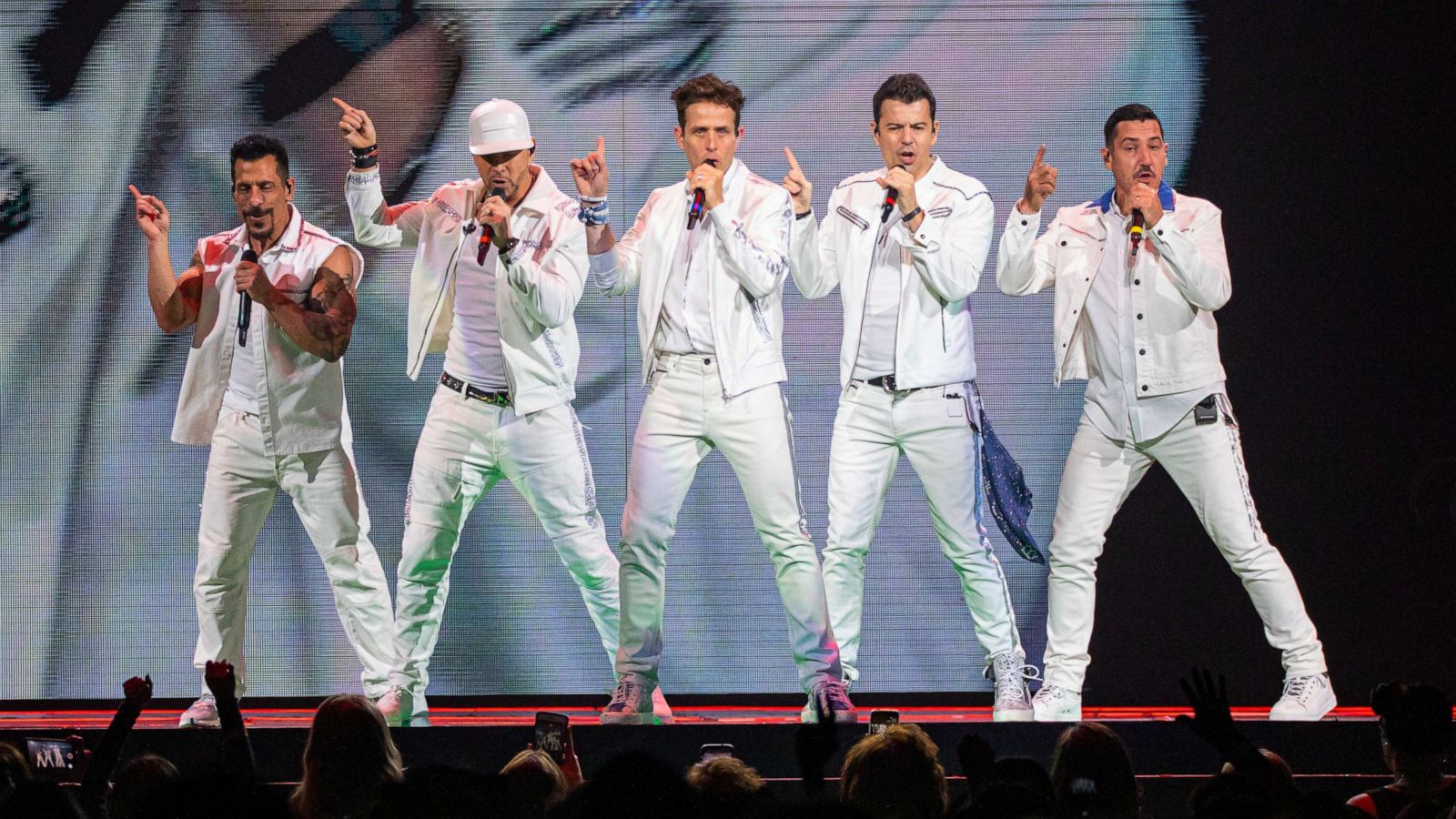 PHOTO: Singers Danny Wood, Donnie Wahlberg, Jordan Knight, Joey McIntyre and Jonathan Knight of New Kids on the Block perform at Little Caesars Arena on June 18, 2019, in Detroit.