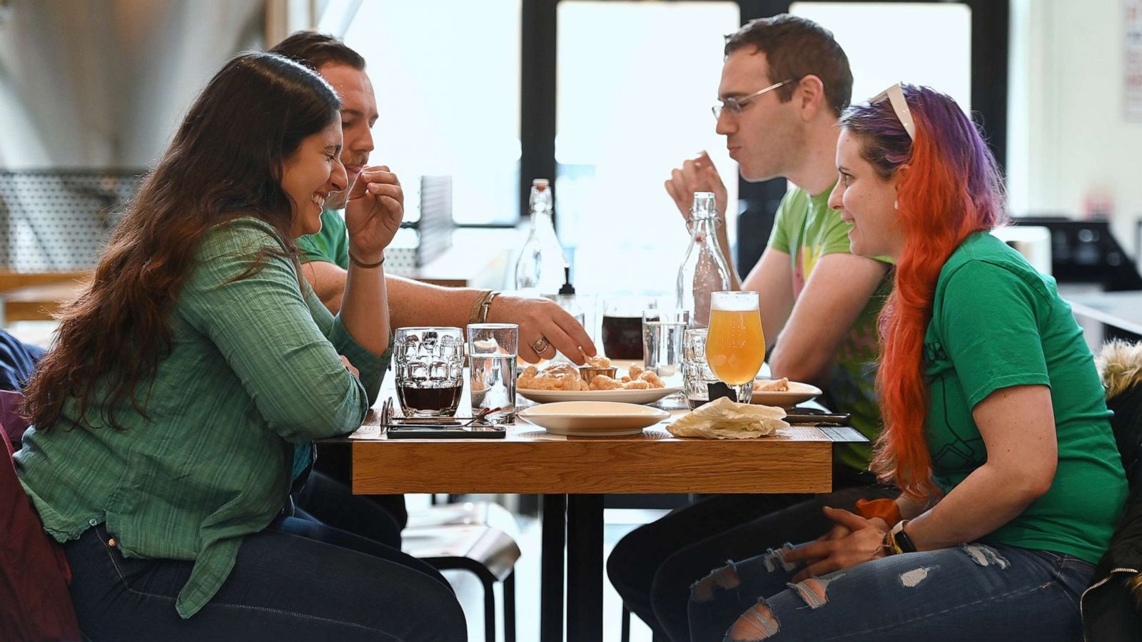 PHOTO: Customers eat inside Torch & Crown Brewing Company in New York, on March 17, 2021.