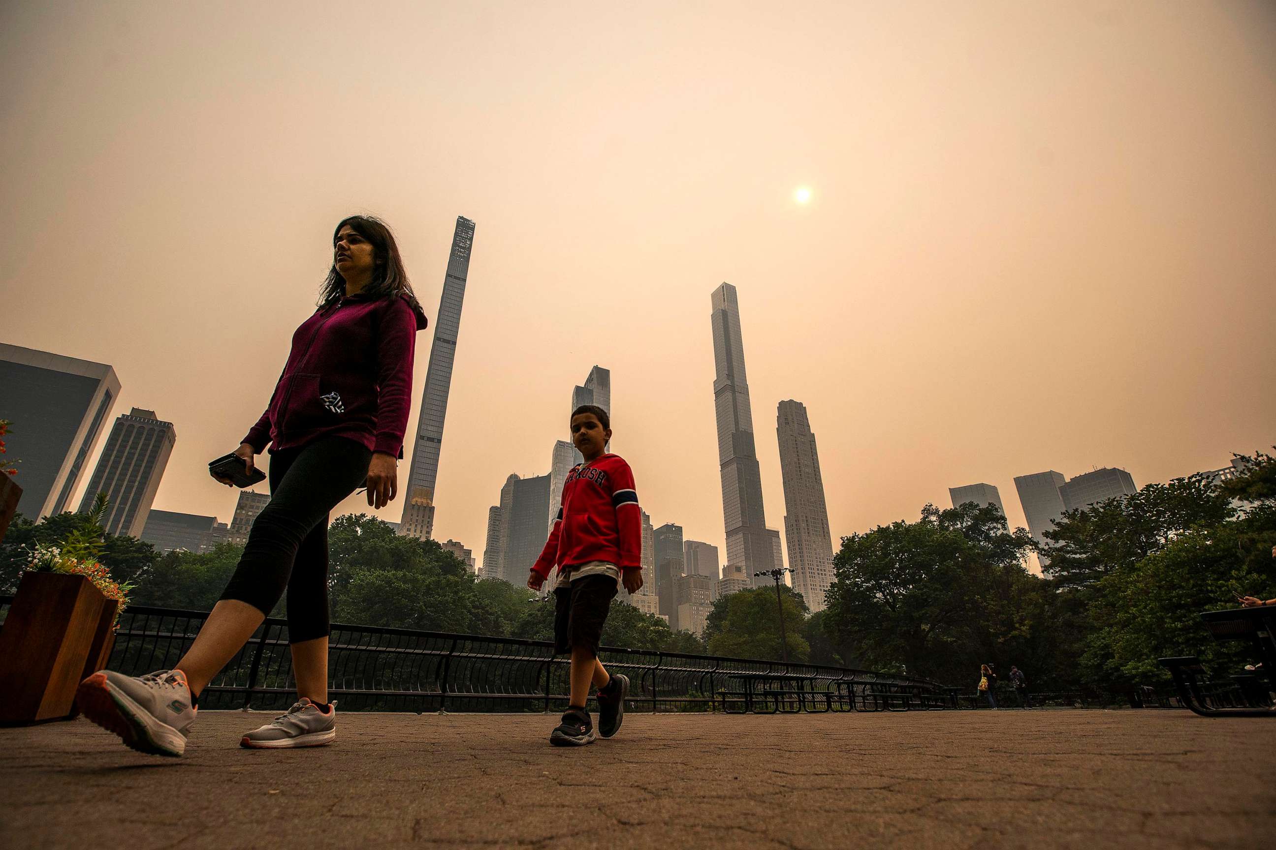 PHOTO: People visit Central Park as smoke from Canadian wildfires casts a haze over the area on June 7, 2023, in New York.