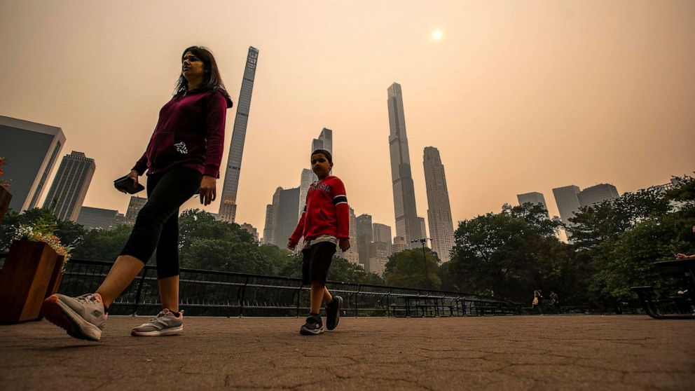 PHOTO: People visit Central Park as smoke from Canadian wildfires casts a haze over the area on June 7, 2023, in New York.