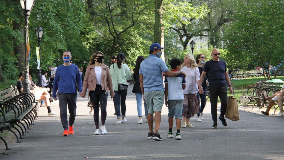 PHOTO: People walk through Central Park in New York City, May 15, 2021.