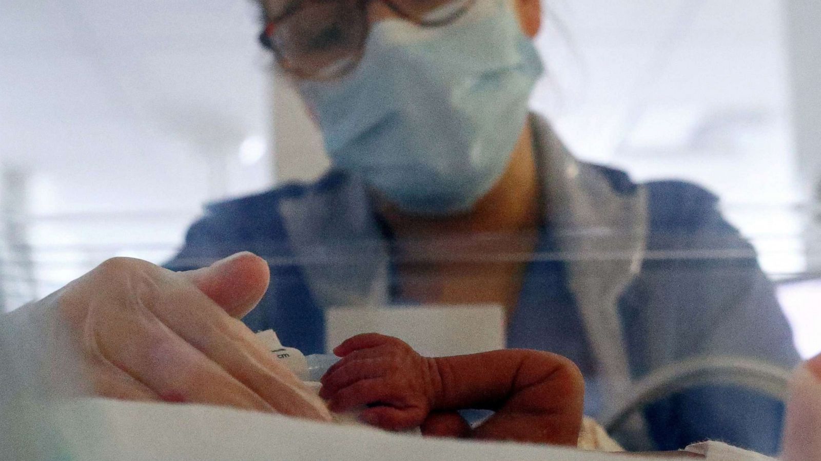 PHOTO: Neonatal nurse Layla Bridges cares for a premature baby in the Neonatal Intensive Care Unit at the Lancashire Women and Newborn Centre at Burnley General Hospital in Burnley, England, May 15, 2020.