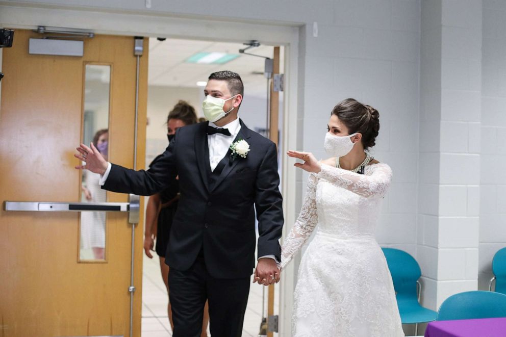 PHOTO: Tyler and Melanie Tapajna arrive at The City Mission in Cleveland, Ohio on their wedding day.