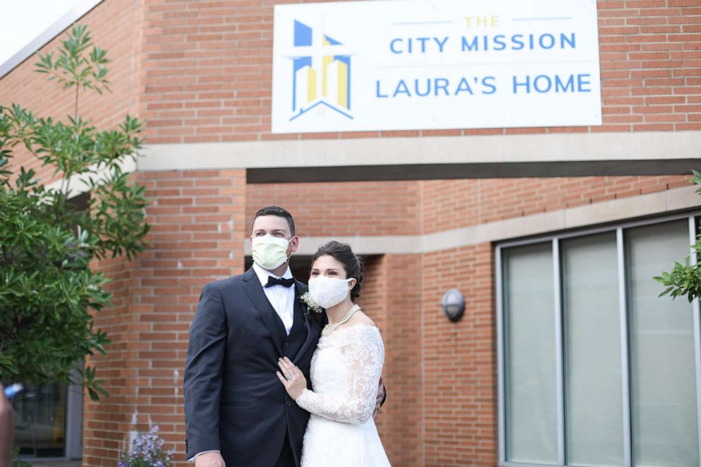 PHOTO: Tyler and Melanie Tapajna in front of The City Mission, Laura's Home after the donated their wedding catering service. 