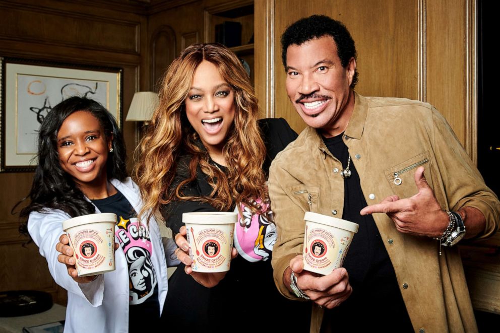 PHOTO: Tyra Banks and Lionel Richie pose with Dr. Maya Warren and their new limited-edition SMiZE Cream flavor All Night Love. 