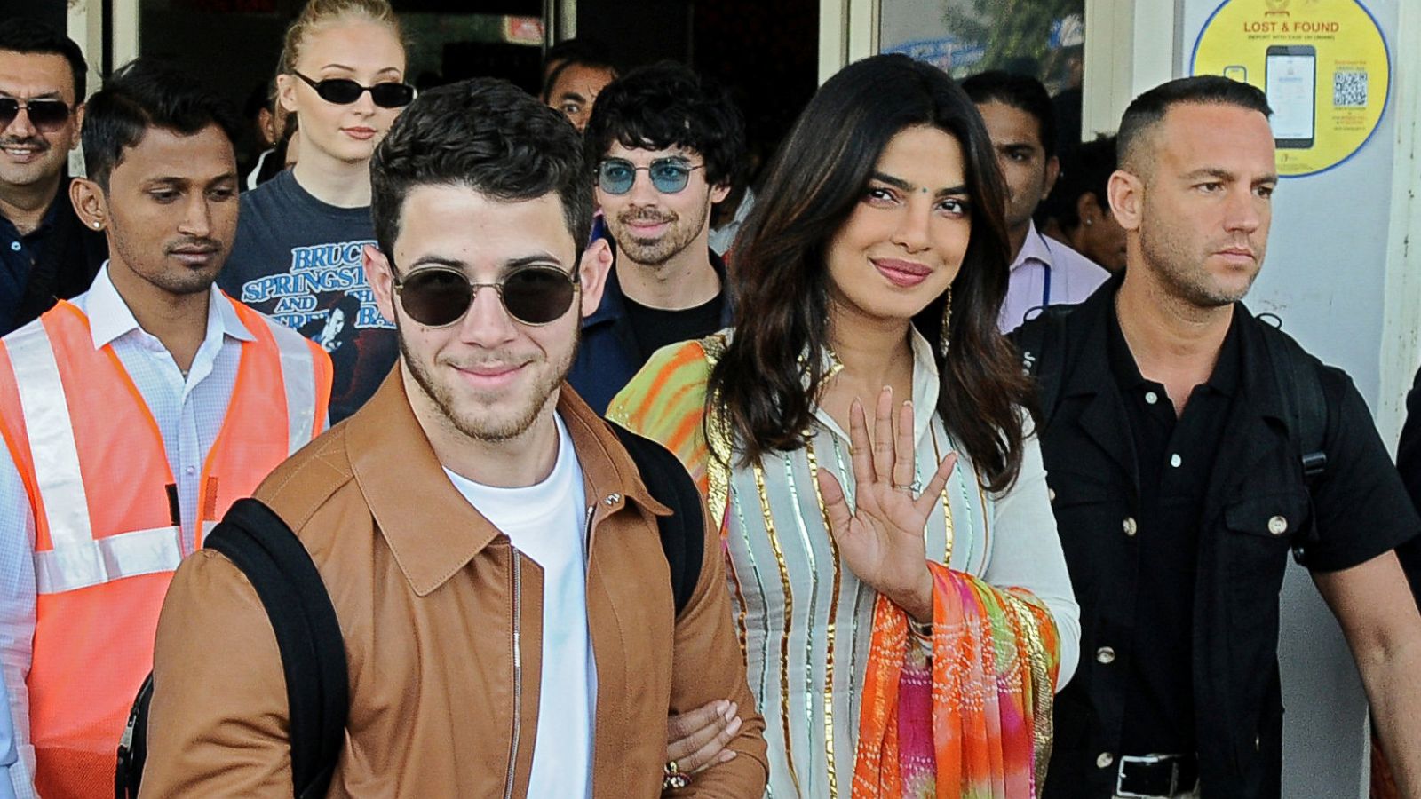 PHOTO: Bollywood actress Priyanka Chopra and singer Nick Jonas wave as they arrive at the airport in Jodhpur in the desert state of Rajasthan, India, Nov. 29, 2018.