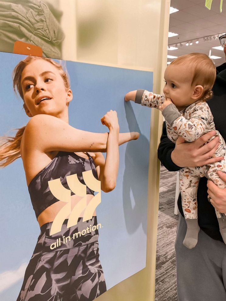 PHOTO: During a recent trip to Target, the Edwards family encountered a poster of a model with a limb difference and captured a photo of Sage looking at the poster.