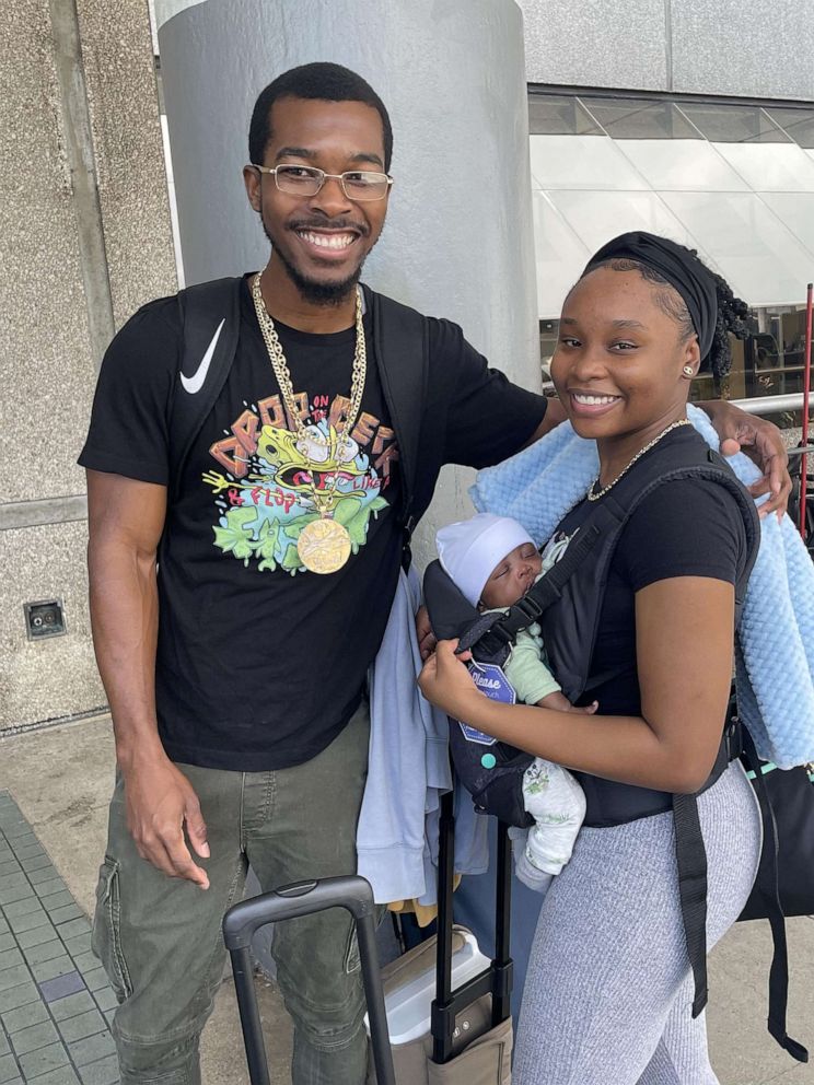 PHOTO: Alvon Lettsome Jr. and Graysel Stuart smile for a photo with their son Alanie.