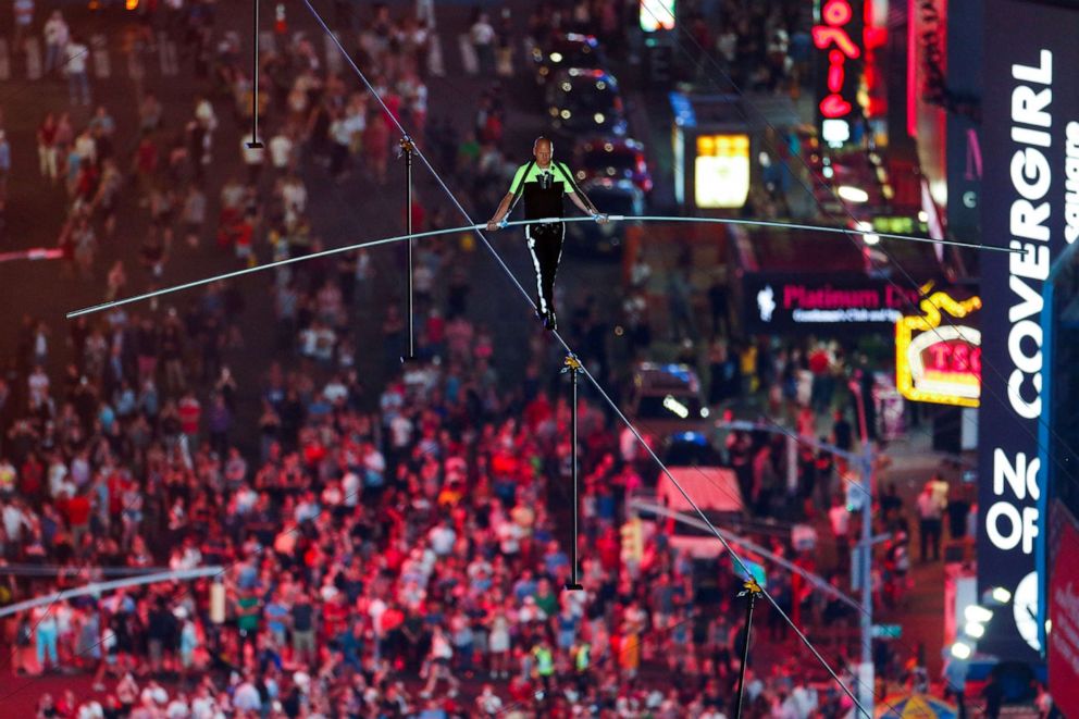 PHOTO: Nik Wallenda walks the highwire over Times Square in N.Y., June 23, 2019.