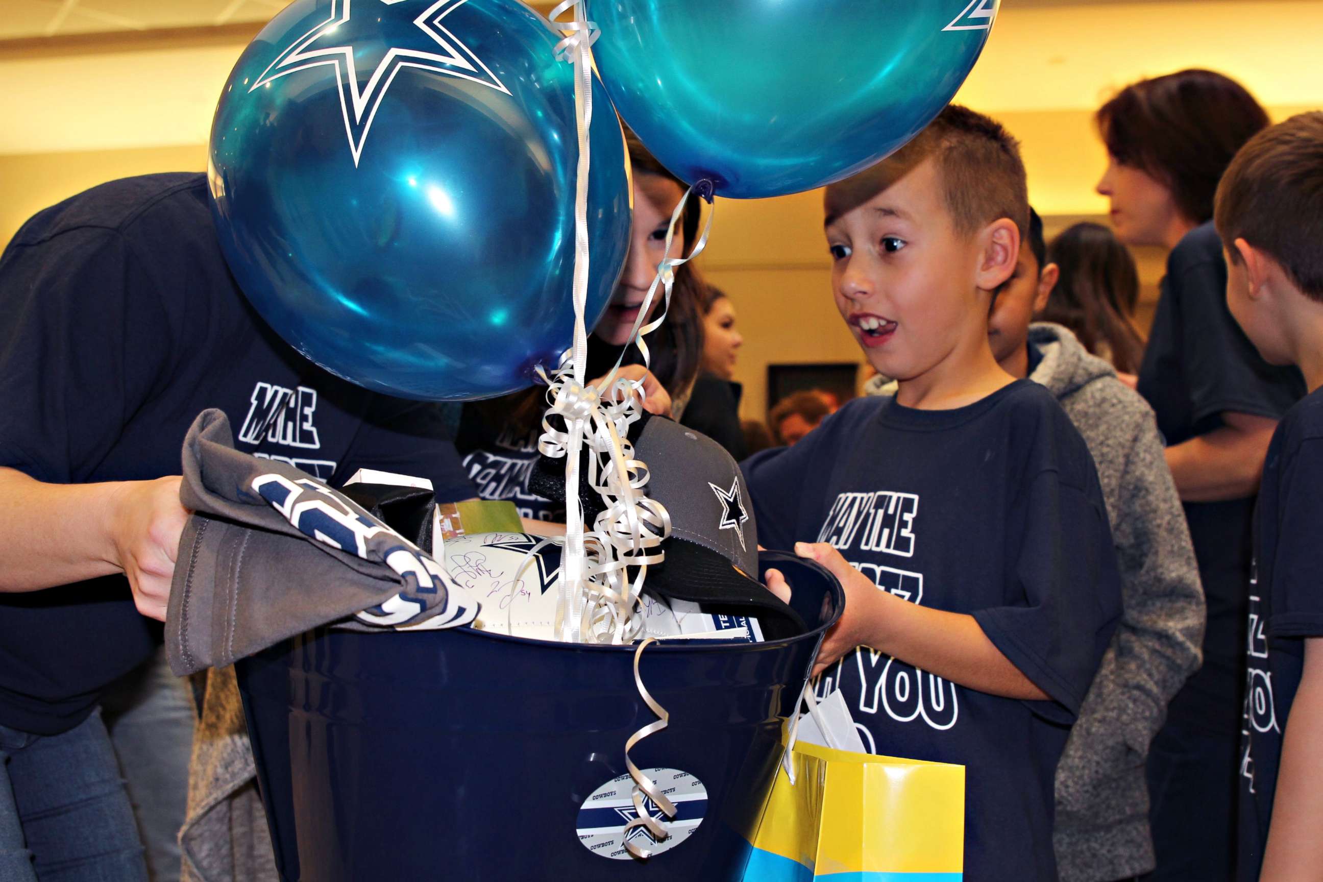 PHOTO: Nike Schwartz, 8, is surprised with Dallas Cowboys memorabilia on his adoption day, Feb. 17, 2020.