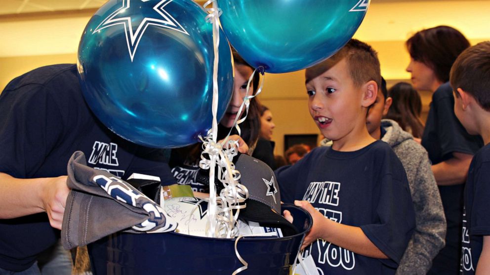 PHOTO: Nike Schwartz, 8, is surprised with Dallas Cowboys memorabilia on his adoption day, Feb. 17, 2020.