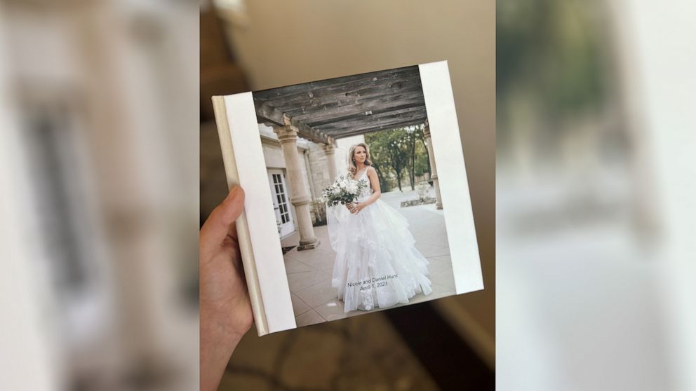 PHOTO: Niki Hunt displays her wedding photo book made by her mom.