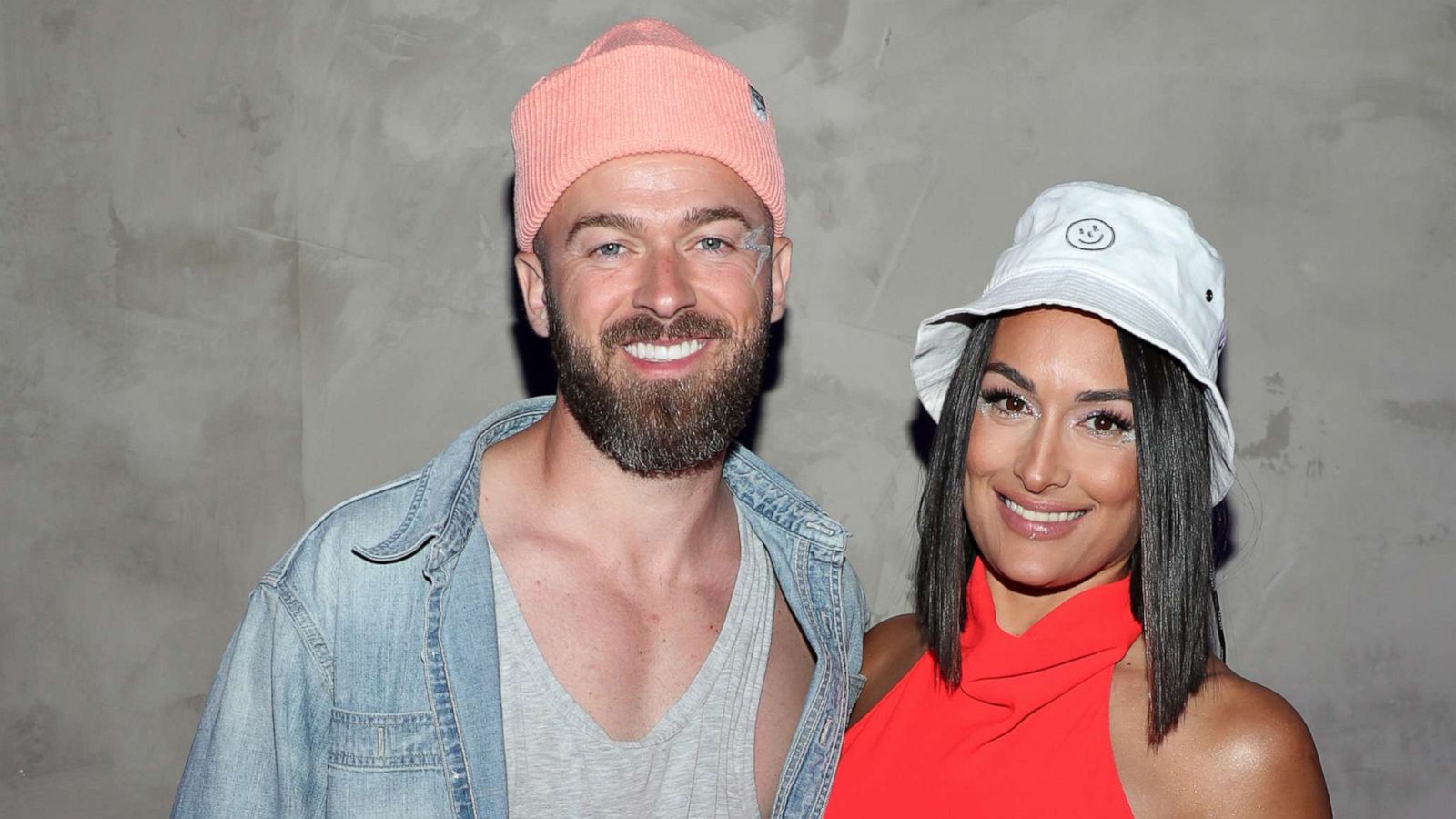 PHOTO: Artem Chigvintsev and Nikki Bella attend Levi's And Tequila Don Julio Neon Carnival, with Hydration By Liquid I.V., April 16, 2022 in Thermal, California.