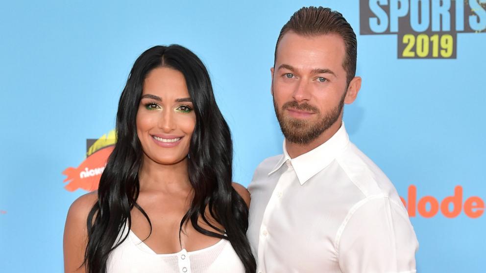 PHOTO: (L-R) Nikki Bella and Artem Chigvintsev attend Nickelodeon Kids' Choice Sports 2019 at Barker Hangar on July 11, 2019 in Santa Monica, Calif.