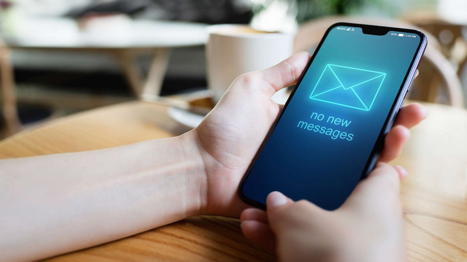 PHOTO: Hands hold a smartphone displaying, "No new messages," in an undated stock photo.