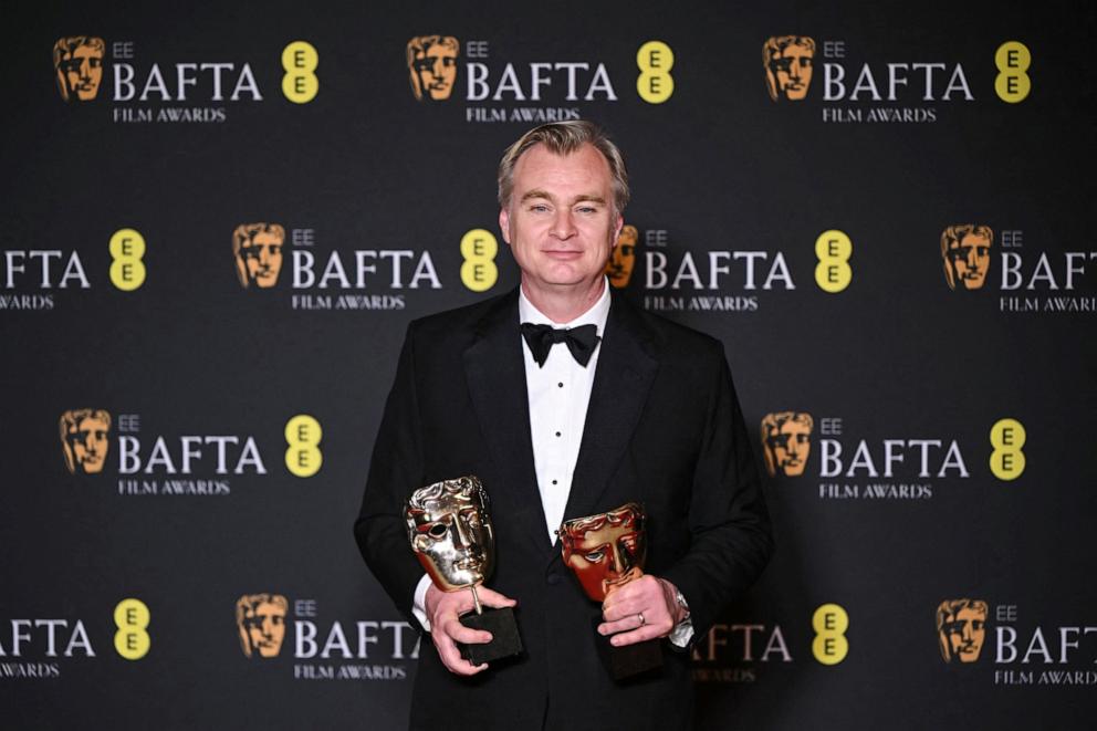 PHOTO: British film producer and director Christopher Nolan poses with the award for Best film and Best director for "Oppenheimer" during the BAFTA British Academy Film Awards ceremony in London, on February 18, 2024.
