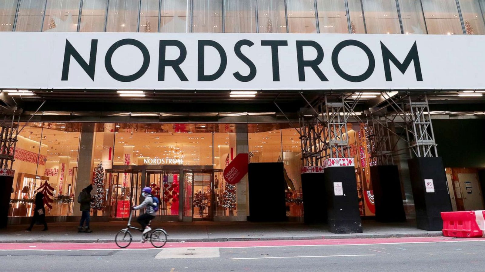 PHOTO: A person rides a bike past the Nordstrom department on 57th Street on Dec. 8, 2020 in New York City.